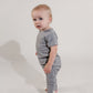Little boy wearing a grey Bamboo Lyocell Zipease Romper